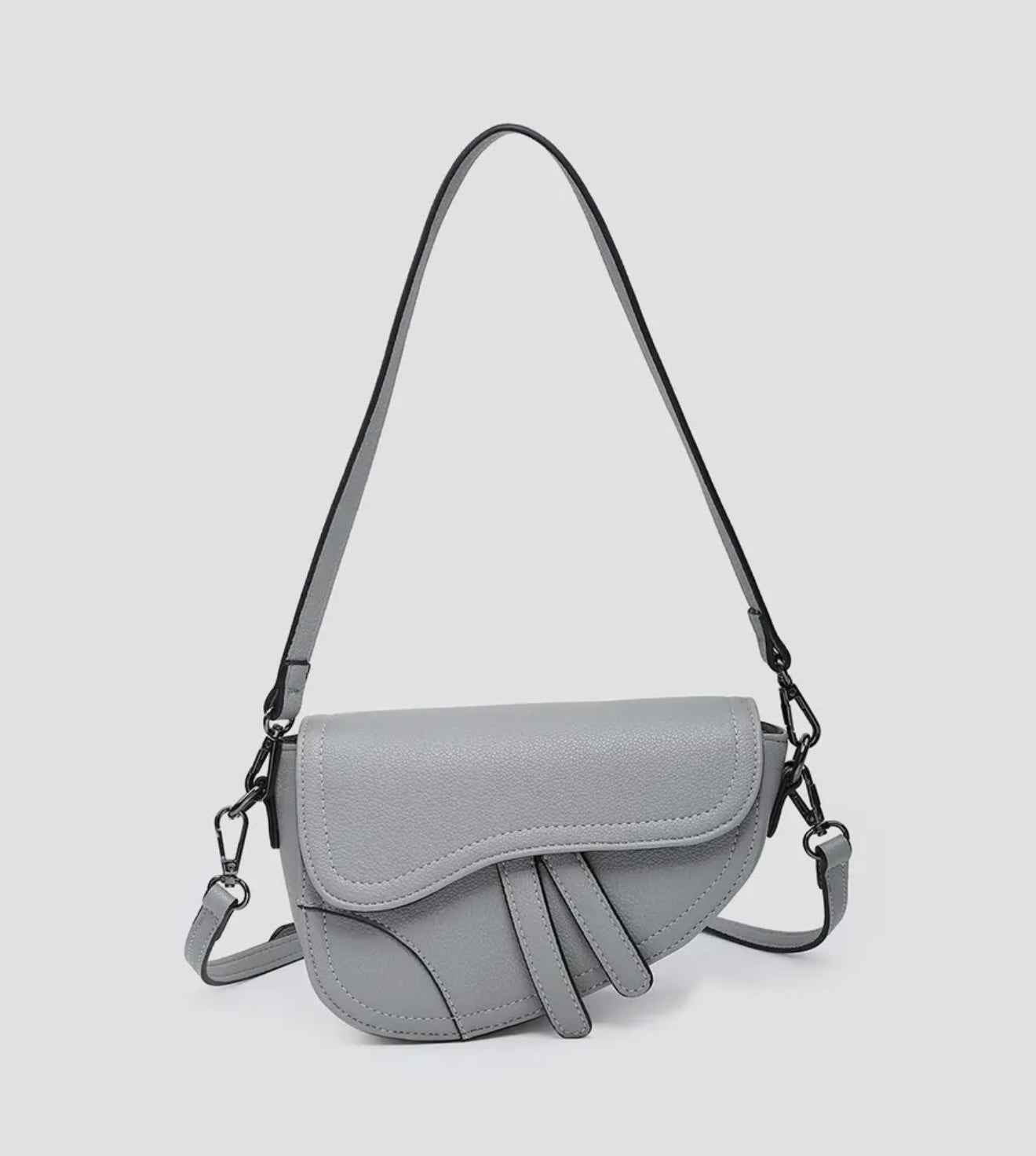Asymmetrical cross-body saddle bag