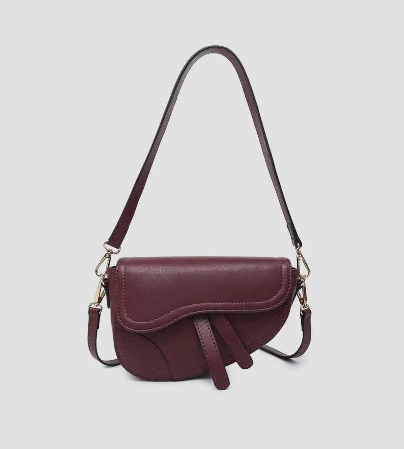 Asymmetrical cross-body saddle bag